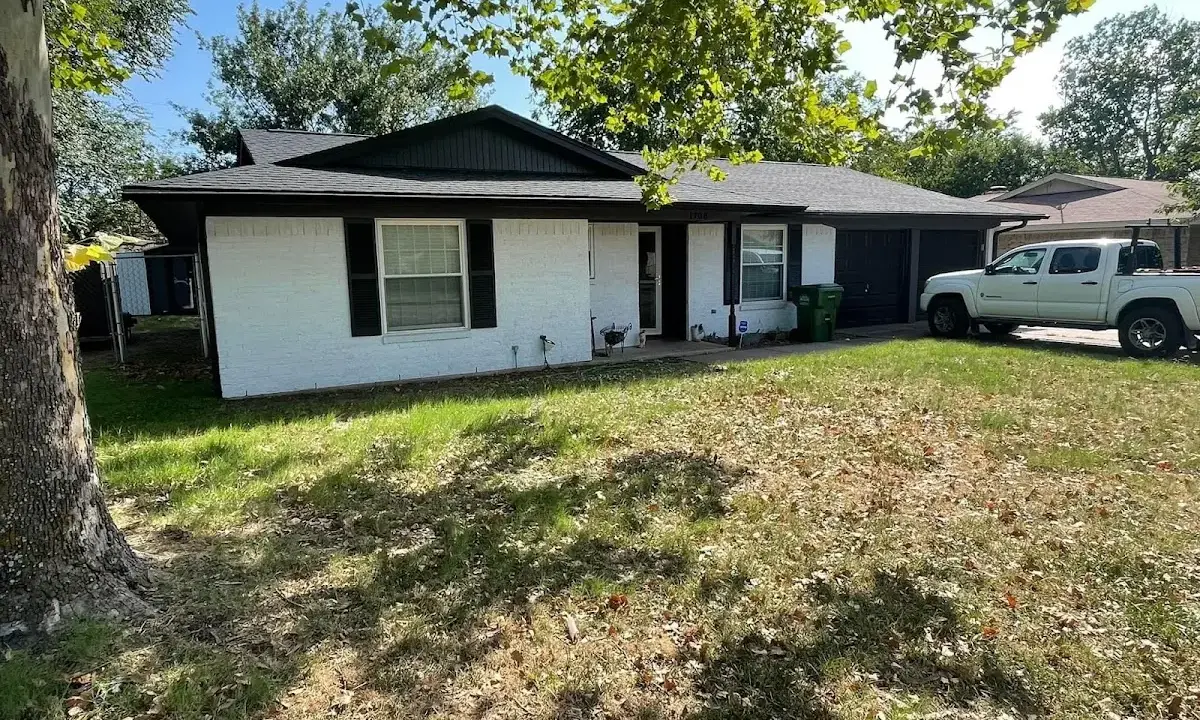 Professional roofing crew working on a residential roof in Boonton